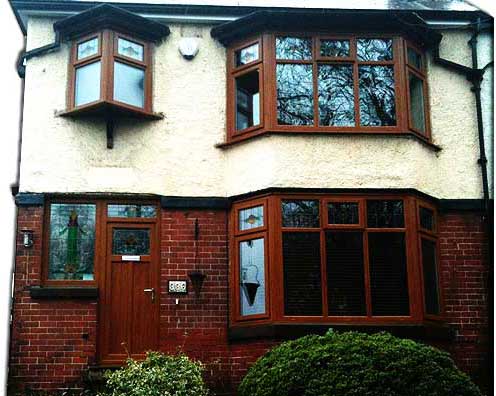 crisp white double glazing windows installed in a 2 story brick sheffield home